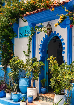 In this example, we hide a house name sign in a beautiful traditional house entrance photo with blue-and-white tones. This makes the porch harder to identify for overly curious tourists. We use a stronger blur radius of 30 to reliably obscure the lettering and rotate the rectangular blur area by 5 degrees so it follows the angle of the sign. (Source: Pexels.)