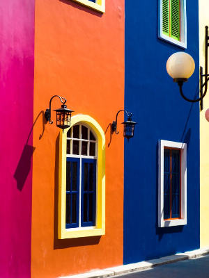 In this example, the bitmap contains painted building facades in strong magenta, orange, and blue colors. We use custom RGB channel weights to control how these colors turn into gray: increasing a channel multiplier makes image areas rich in that channel move toward lighter gray tones, while lower multipliers keep them darker. We also limit the output to eight gray colors, which breaks the wall paint and plaster texture into spotted, poster-like patches. (Source: Pexels.)