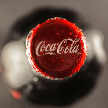 In this example, we place a circular sharpening area over a Coca-Cola bottle cap and increase the sharpness to 100%. This makes the cap much clearer as the main focus of the bitmap: the water droplets gain a crisp, bead-like structure, the red metal edge becomes better defined, and the white logo stands out more cleanly against the glossy surface. (Source: Pexels.)