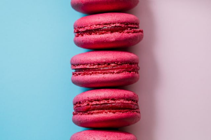 In this example, we horizontally flip a BMP image of pink macarons arranged in a vertical line. The pink and blue background areas switch places: the blue half moves from the left to the right, and the pink half moves from the right to the left. As the horizontal flip mirrors the bitmap across its vertical axis, the stack of macarons positioned on this axis remains centered between the two colors. (Source: Pexels.)