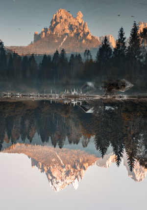 In this example, we vertically flip a BMP image of a mountain reflected in a calm lake. The mountain and its reflection in the lake switch places: the reflection moves to the top of the bitmap, while the real mountain moves to the bottom. (Source: Pexels.)