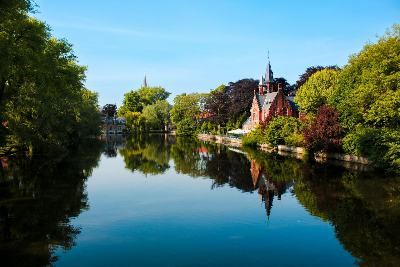 In this example, we convert a bitmap photo of a calm historic canal to grayscale using the average RGB formula. This method gives equal importance to the red, green, and blue channels, so the bright sky, leafy trees, brick building, and dark water reflection are all reduced to a smooth and neutral gray range. (Source: Pexels.)
