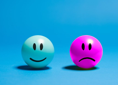 In this example, the bitmap contains two glossy smiley balls, one blue and one yellow. We choose the yellow smiley's base color rgba(164, 173, 18, 255), and change it to magenta with 40% sensitivity. To keep the smiley looking round and three-dimensional, we enable the option that preserves light and dark color details. (Source: Pexels.)