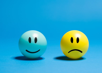 In this example, the bitmap contains two glossy smiley balls, one blue and one yellow. We choose the yellow smiley's base color rgba(164, 173, 18, 255), and change it to magenta with 40% sensitivity. To keep the smiley looking round and three-dimensional, we enable the option that preserves light and dark color details. (Source: Pexels.)