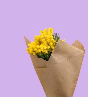 In this example, we give a yellow flower bouquet a new bitmap background. We click the pale background in the input image to pick rgba(251, 244, 238, 255) as the color to replace, set the color sensitivity to 15%, and enter rgb(210, 177, 233) as the replacement color. We also smooth the boundary with a 1-pixel radius, which gently blends the tiny edge pixels into the new lavender background. (Source: Pexels.)