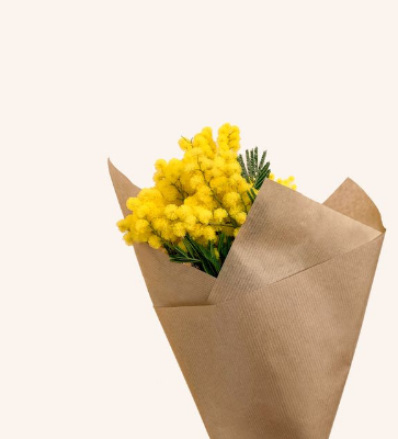 In this example, we give a yellow flower bouquet a new bitmap background. We click the pale background in the input image to pick rgba(251, 244, 238, 255) as the color to replace, set the color sensitivity to 15%, and enter rgb(210, 177, 233) as the replacement color. We also smooth the boundary with a 1-pixel radius, which gently blends the tiny edge pixels into the new lavender background. (Source: Pexels.)
